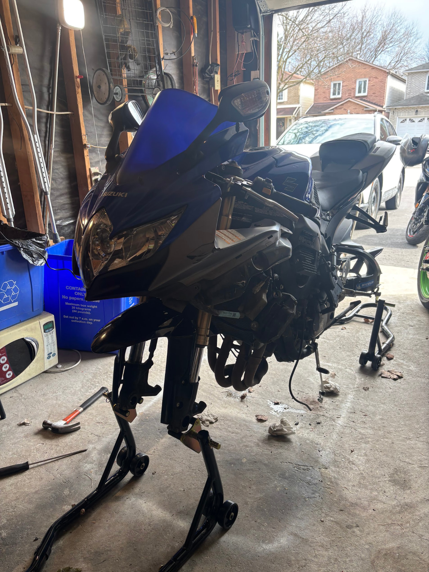 Blue Suzuki sport bike on stands in the 2WheeledMechanic workshop